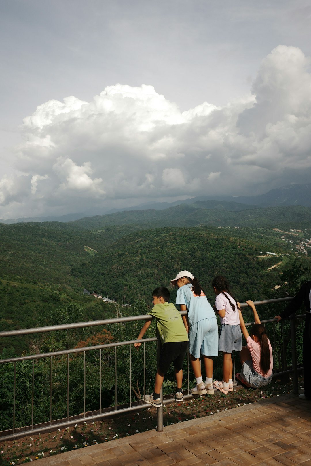 Elderly Japanese tourists admiring a mountain view during a day trip
